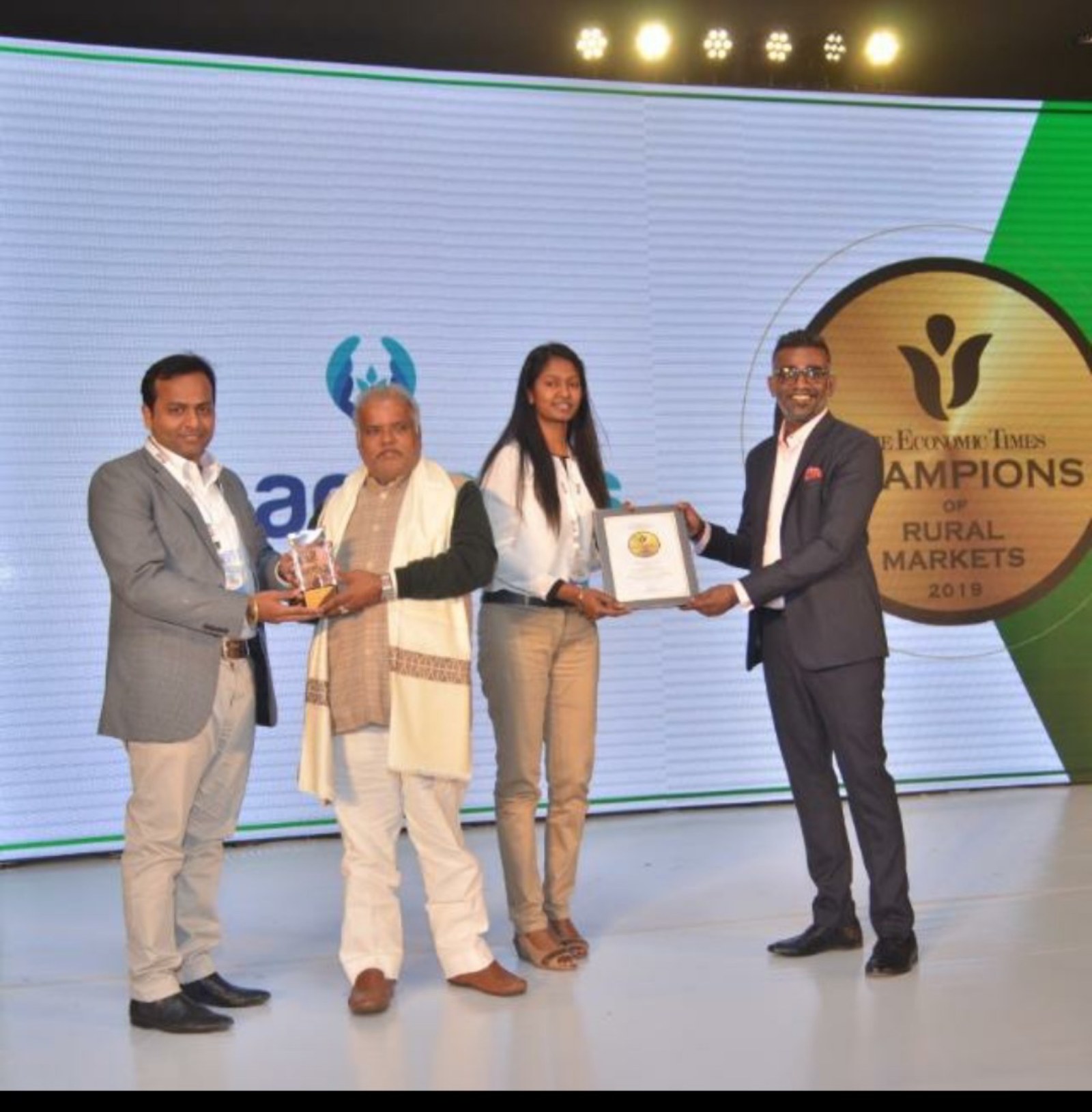 Farmreach Technologies receiving The Economic Times Champions of Rural Markets recognition on stage in Mumbai